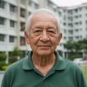 Senior man at his HDB flat in Singapore, now confident with digital banking after our course