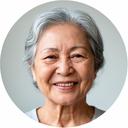 Senior woman smiling warmly, a learner at our Singapore digital literacy programme